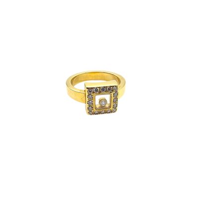 a close up of a gold ring with diamonds on it
