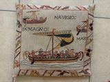 a pillow that has a picture of a boat on it