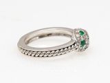 a white gold ring with emerald and diamonds