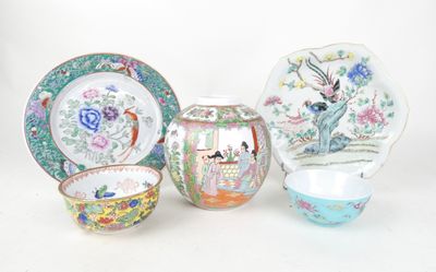 four pieces of chinese porcelain on a white background
