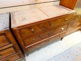 two wooden dressers sitting next to each other in a room