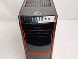 a black and red computer tower on a white surface