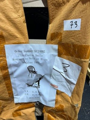 a sign on the back of a parking meter that has a sticker on it
