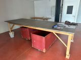 a table with two red bins on it in a room