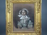 an old picture of a woman in a dress with a bonnet