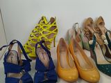 several pairs of women ' s shoes are lined up on a shelf