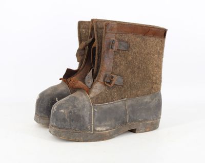 a close up of a pair of boots on a white surface