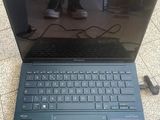 an open laptop computer sitting on top of a tiled floor
