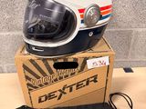 a helmet sitting on top of a box next to a bag