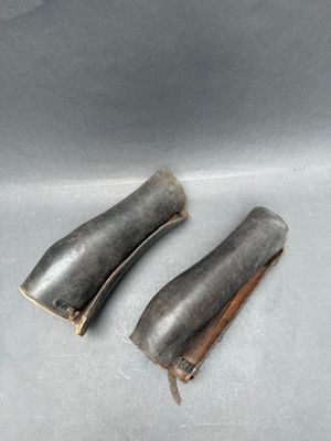 these are two pieces of metal that are sitting on a table