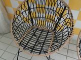 yellow and white checkered wall with two chairs and a table