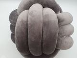 a close up of a stuffed animal ball on a white surface
