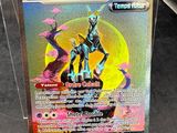 a close up of a pokemon card in a display case