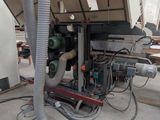 an image of a machine that is working on a piece of wood