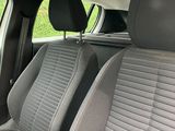 the interior of a car with two seats and a steering wheel