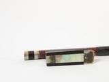 a pen that is sitting on a white surface