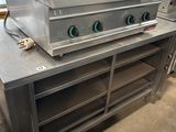 an image of a commercial gas range in a kitchen with two burners on top of it