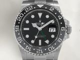 une montre Rolex avec un cadran noir et une trotteuse verte