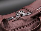 a close up of a purse with a zipper on it