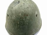 a close up of a helmet on a white surface