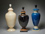 three vases sitting next to each other on a table