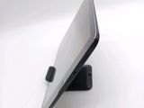 a cell phone that is sitting on top of a stand