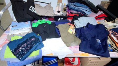 a pile of clothing sitting on a table in a room