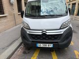 a white van that is parked on the side of the street