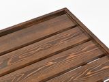 a close up of a wooden crate on a white surface