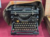 an old typewriter that is on display in a case