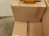 cardboard boxes stacked on top of each other in a room