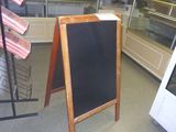 a chalk board in the middle of a store