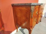 a wooden cabinet with a marble top on a stand