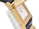 an image of a close up of a wrist watch with a gold plated case