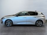 the silver car is parked on the concrete floor in the room