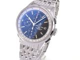 a silver watch with a blue face on a white background