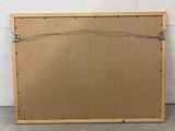 a wooden frame with wires attached to it in front of a white wall