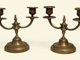 pair of antique brass candelabs with candlesticks on pedestal