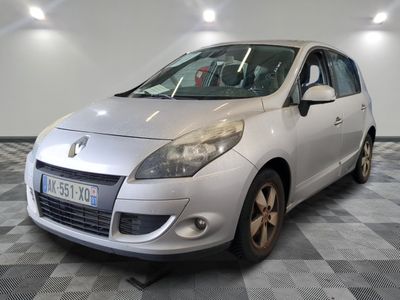 a picture of a silver car parked in a garage
