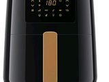 the philips air fryer is black and has a gold strip on the side of it