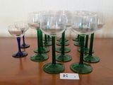 several wine glasses are lined up on a table with a price tag