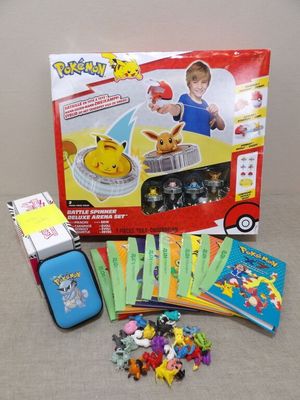 a box of pokemon cards and a case of games