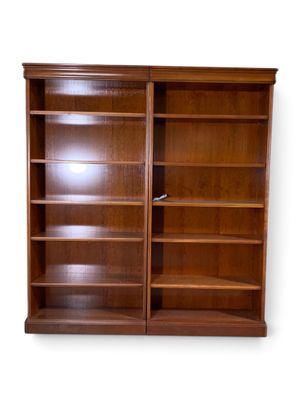 an image of a wooden bookcase with two doors open