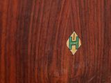 a close up of a wooden table with a cross on it