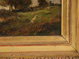 a picture of a painting of a landscape in a gold frame