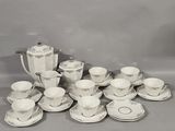 a picture of a collection of white and silver tea and coffee sets