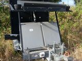 a small trailer that has two televisions in it