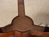 a close up of a wooden table with a mirror on it