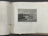 an open book with a picture of a boat in the water