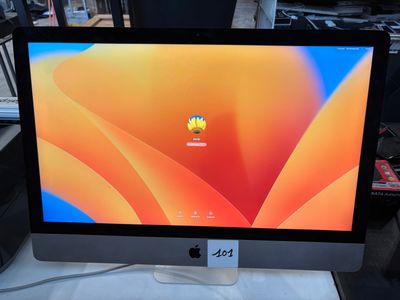 a computer monitor sitting on top of a table